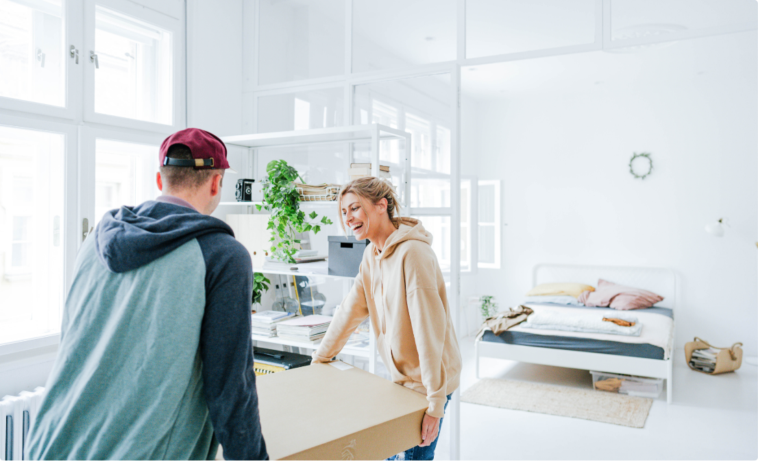 Happy couple moving into a condo